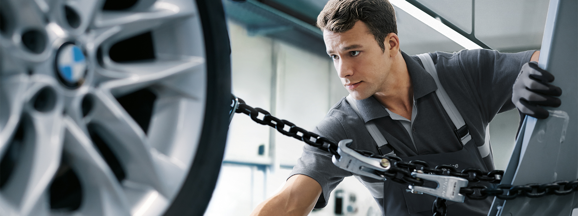 BMW vehicle driving on a winding road.